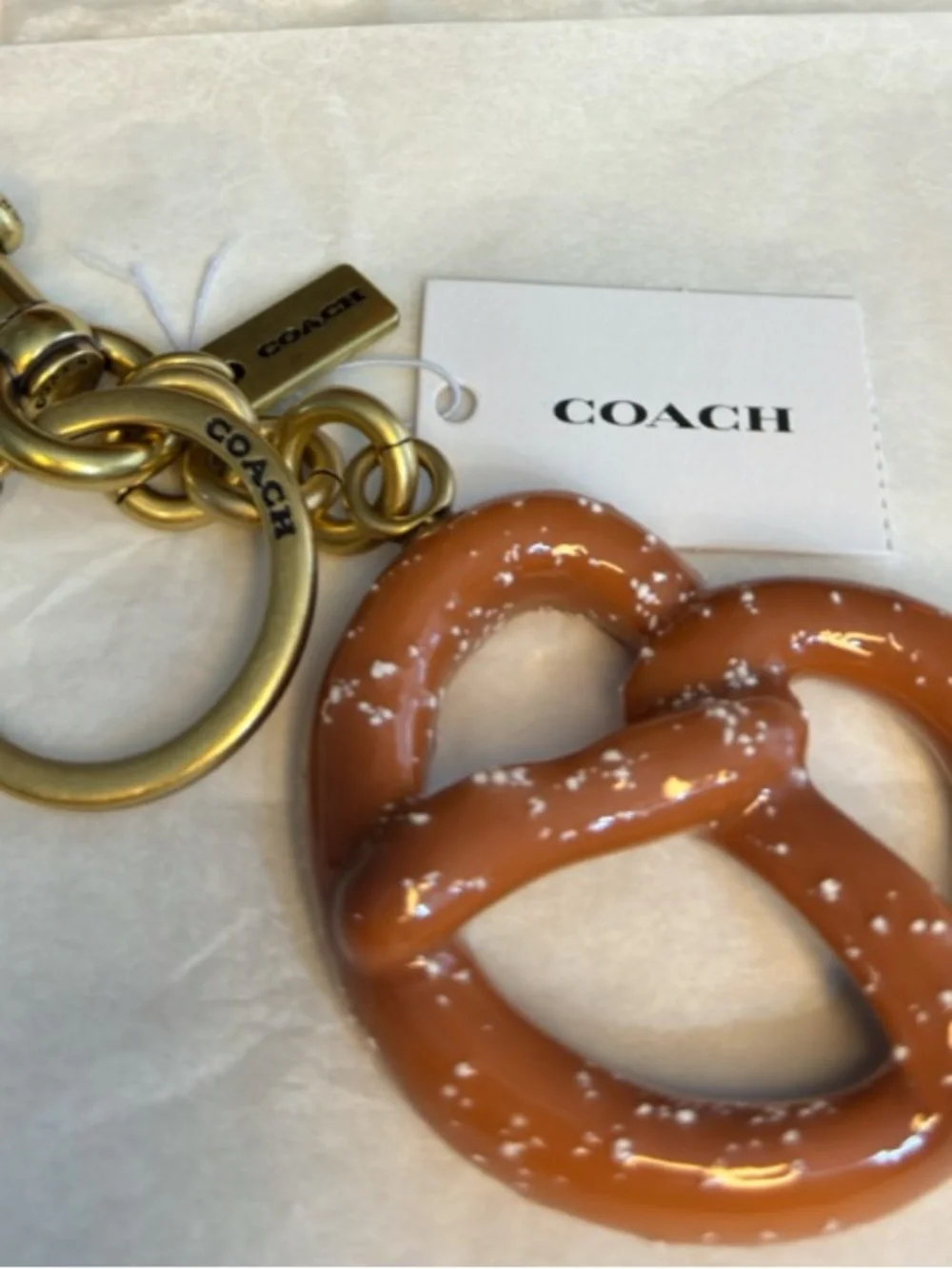 HOT!!!!  Coach Gold-Tone Pretzel Purse Charm in Brown.  NWT and Dusty